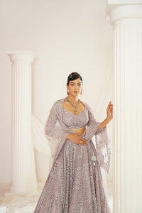 Lavender embroidered dori and mirror work blouse, lehenga and dupatta set