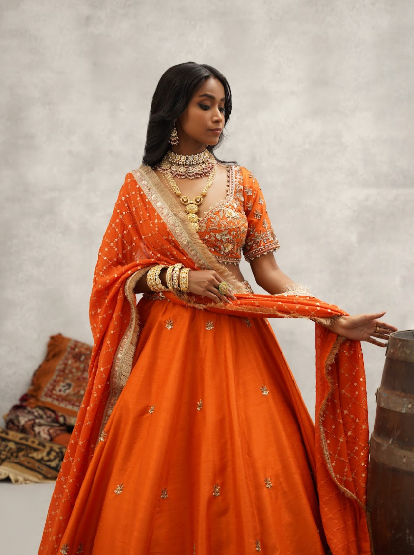 Orange embroidered blouse, lehenga and dupatta set